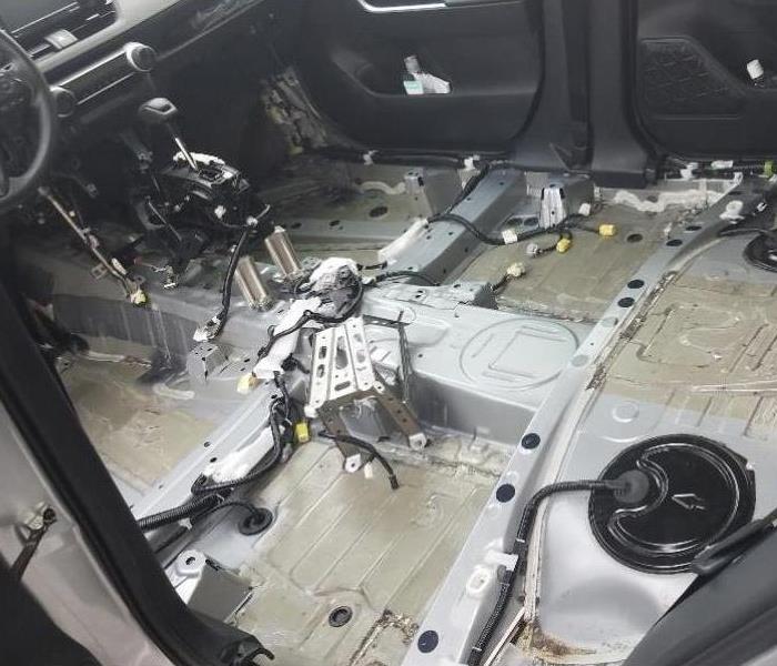 inside of a car with seats and carpet removed